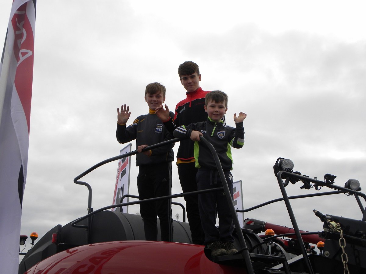 Michael Dempsey (5), Ryan Dunne and Killian Brennan (13) at the Case IH stand.