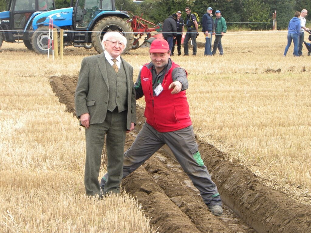 President Higgins alongside Cork East ploughman, Dave Mulcahy.