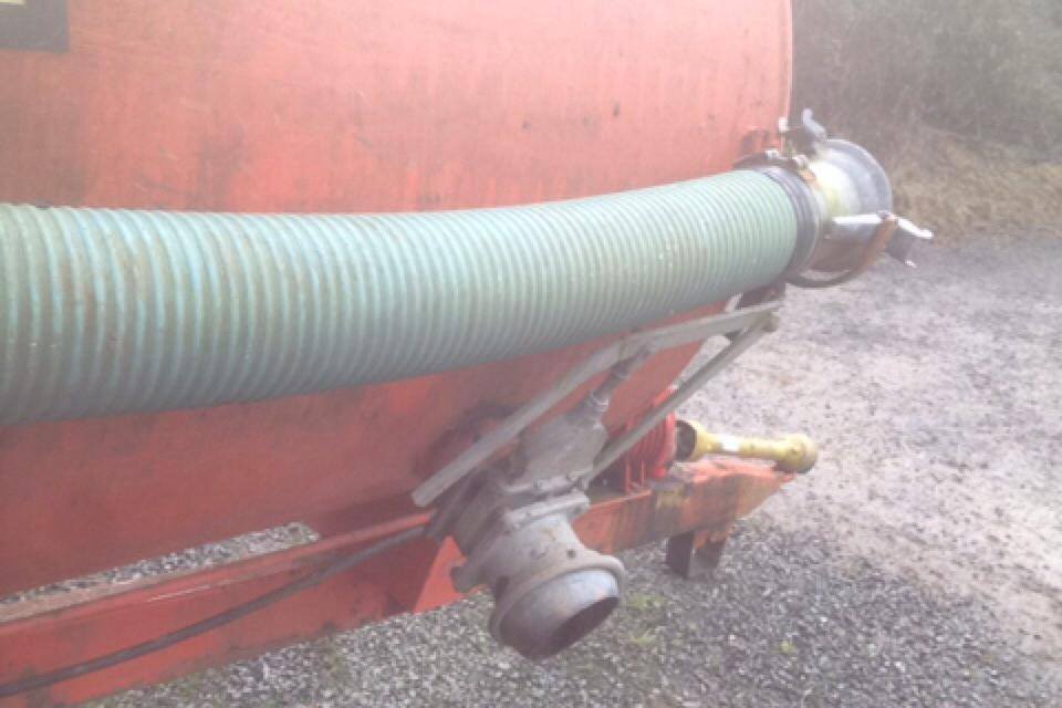 A side filling point and pipe on a vacuum tanker.