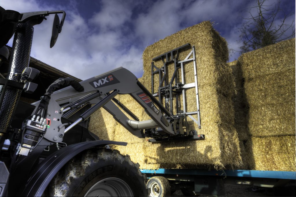 An MX loader coupled to a Manubal bale grab.