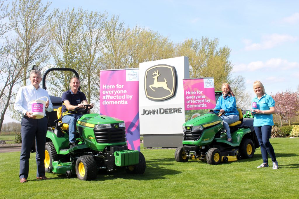 John Deere Limited Turf Division Manager Chris Meacock, Andy and Kathryn Maxfield, and Alzheimer’s Society Regional Community Fundraising Officer Sue Swire