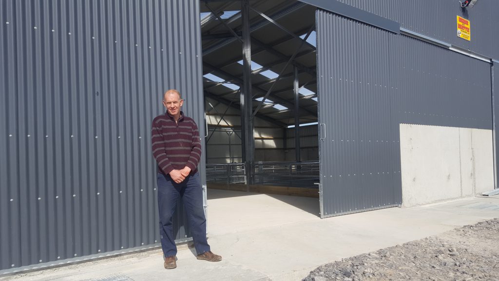 John Tiernan outside his newly-constructed sheep shed