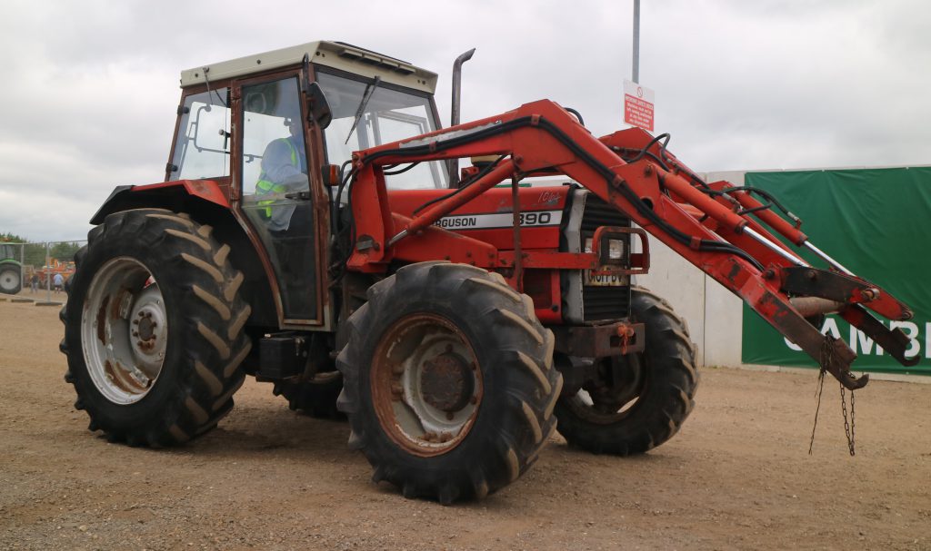 This 4WD Massey Ferguson 390, with a front loader and showing some rust, sold for €7,178