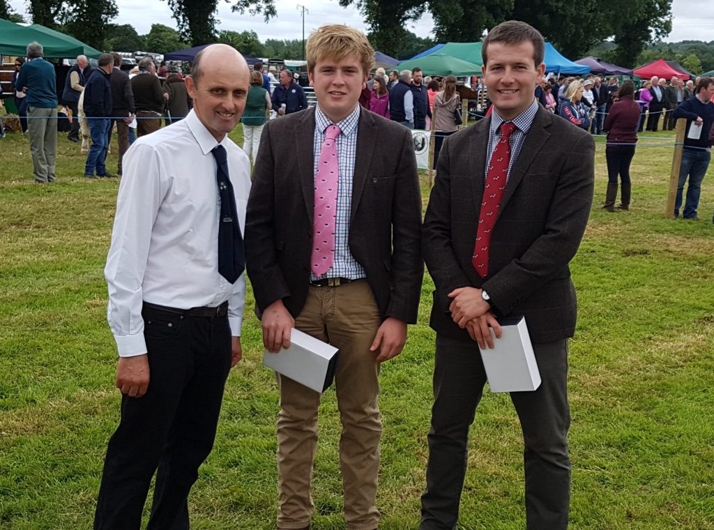 JJ Farrell makes a presentation to the two judges of the competition, Andrew Whitlow and Ben Lewis