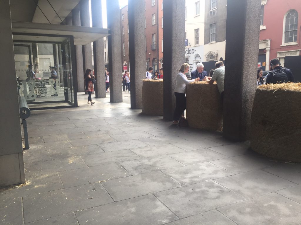 The bales were moved a safe distance away from the glass front of the building