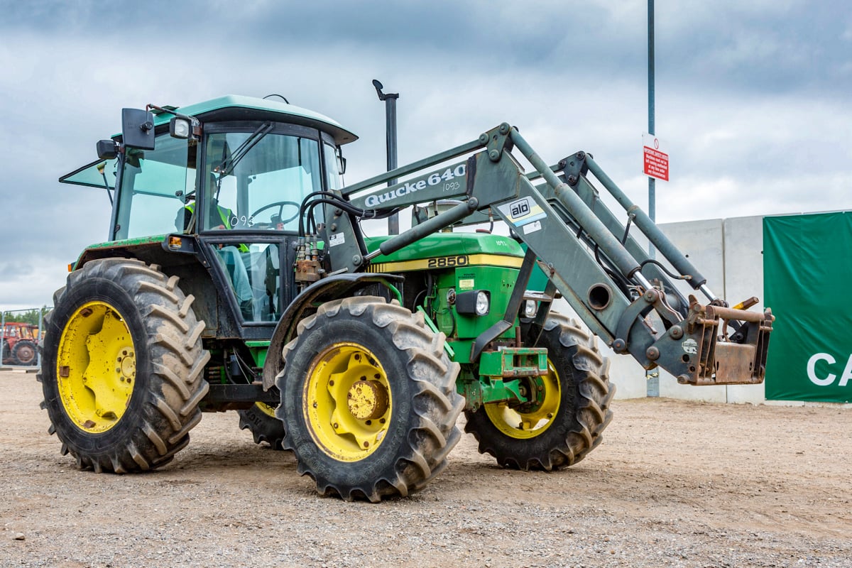 Mean, green machine: This 1986 John Deere 2850 (SG2 cab) with a Quicke front loader and 6,144 hours on the clock sold for a reasonable £7,000