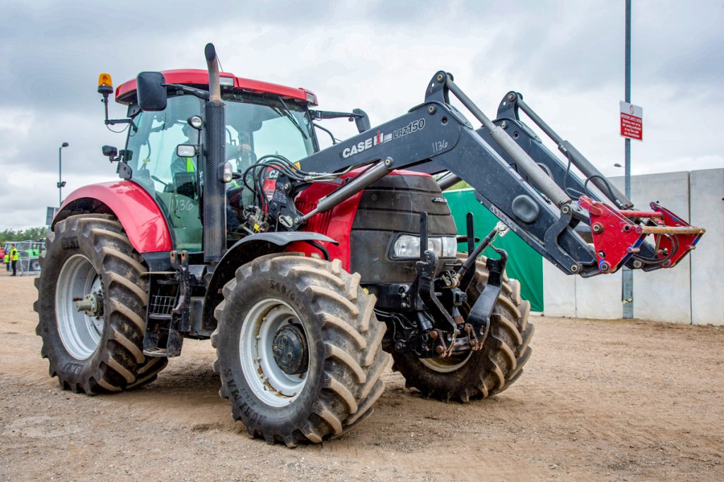 ‘Red’ power: This 2011 Case IH Puma 155 (with a Case IH front loader) had 8,489 hours showing. The hammer fell at a sale price of £26,200