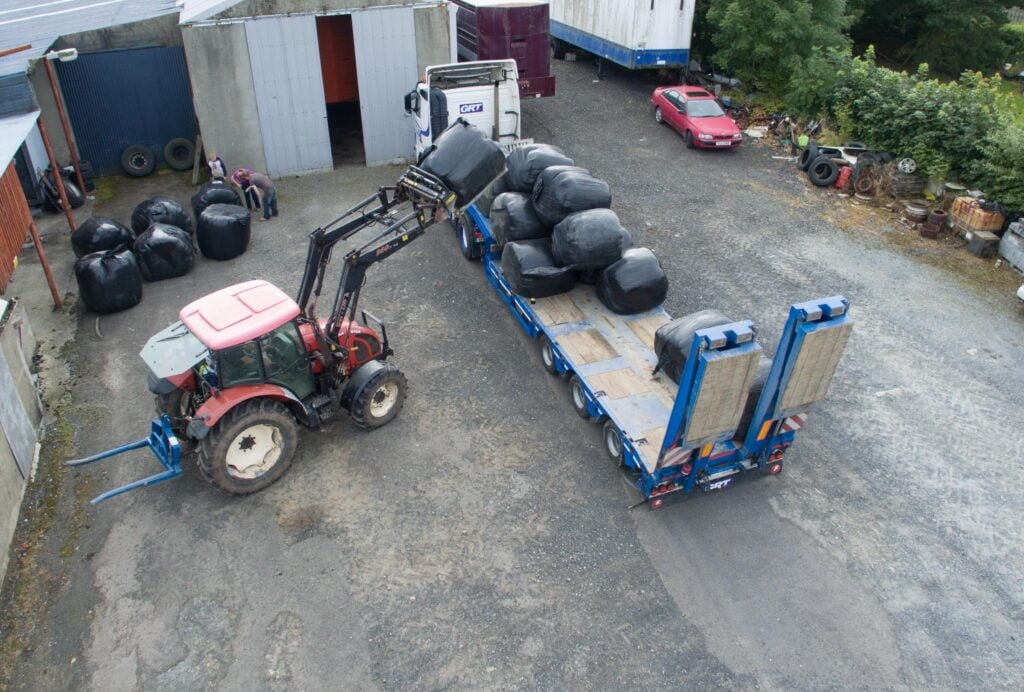 Dan O’Gallagher unloads a load of fodder donated by farmers in Co. Wexford. Photo Clive Wasson
