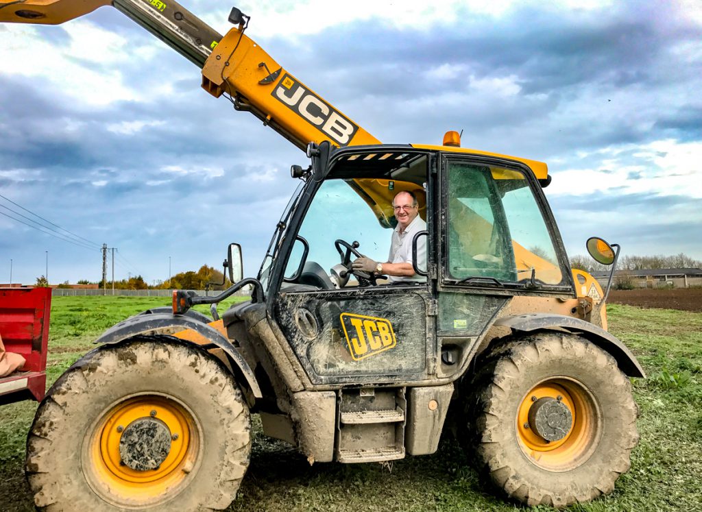 Gerry Flynn unloading a bag of seed – for his Amazone drill