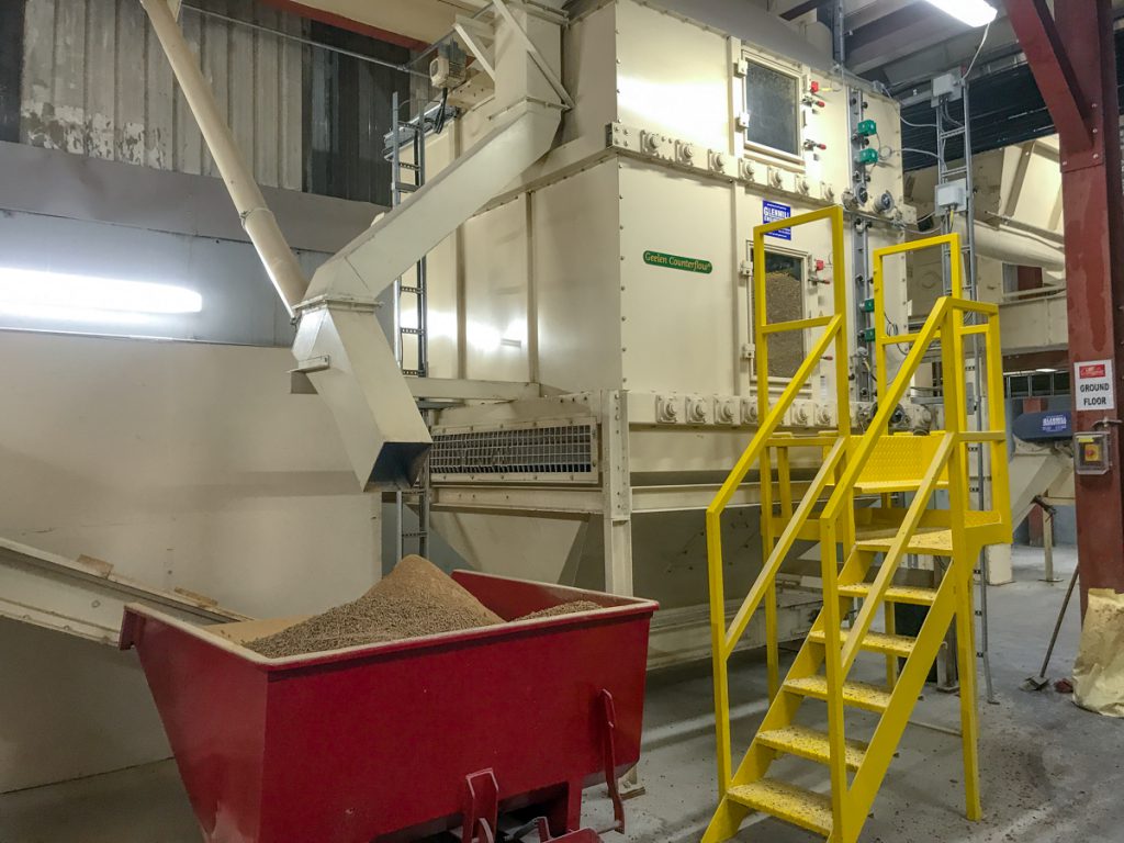 The twin-deck cooler in the pelleting mill. The bin is for overflow material
