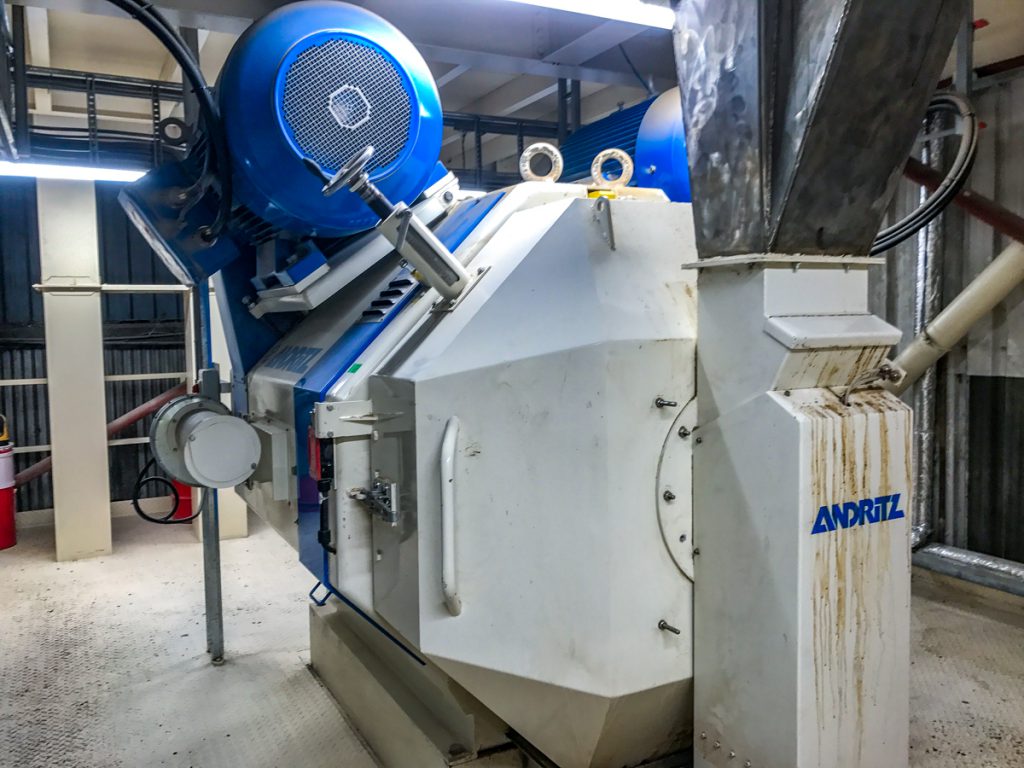 One of the feed presses in the pellet mill. Meal is feed pressed twice and screened before going into the cooler