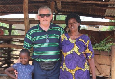 Tom Byrne with the recipient of an Irish cow