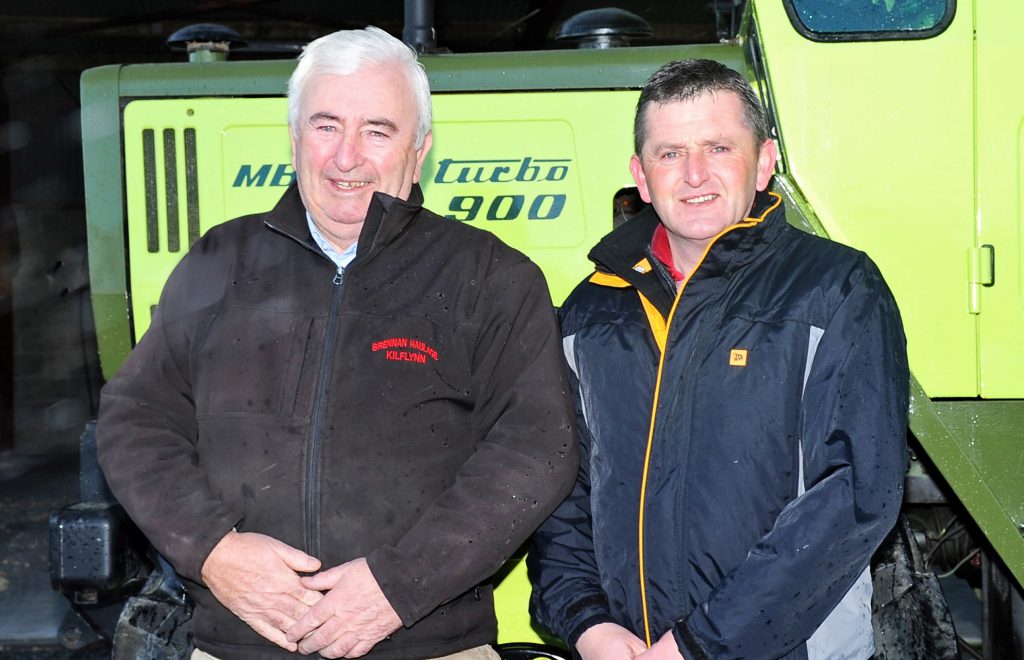 Liam Brennan (right) pictured with his father John. His MB Trac 900 Turbo looms behind
