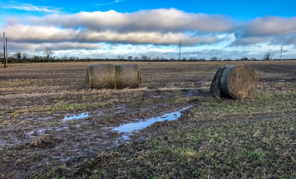 The stolen tractor and trailer were driven across a field behind the farmyard