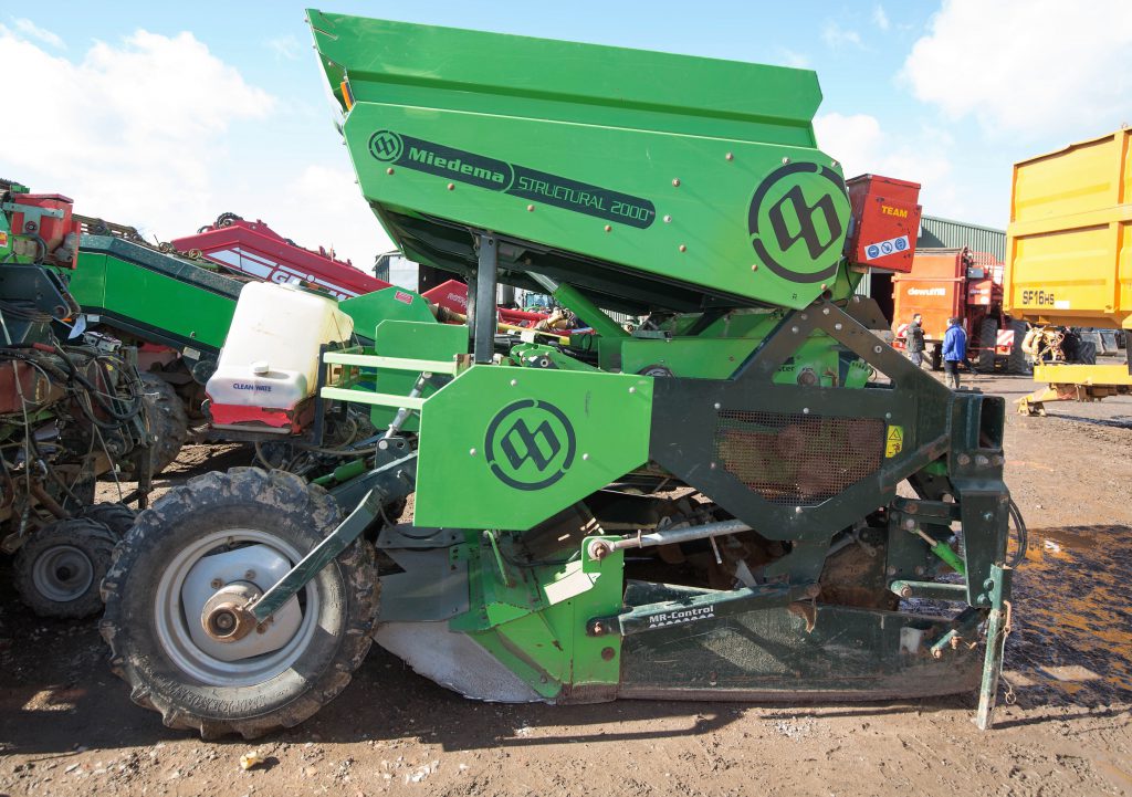 This 2012 Miedema Structural 2000 Hillmaster (two-row belt planter; tipping hopper; applicator unit) sold for £12,000