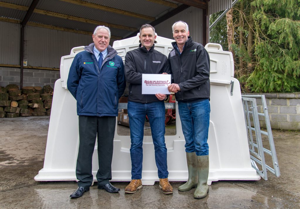 Victor and Noel Kelly presenting Tommy with his new Agri-Plastics calf hutch
