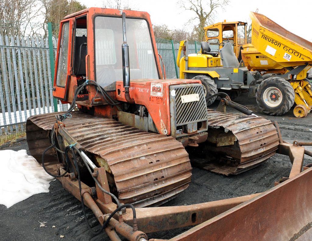 This so-called 'Big Track Swamp Tractor' is a 'curious' lot. Showing just 699 hours on the clock, it's equipped with a front blade