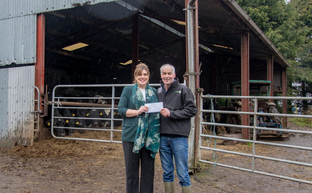 Barbara Allen, from FBD, presenting Tommy with his weekend away