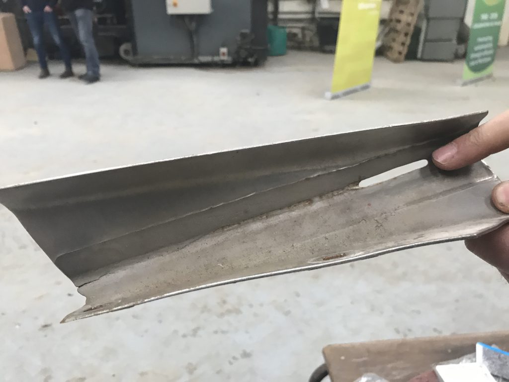 A damaged vein. A hole has been made in the vein and cracks have developed