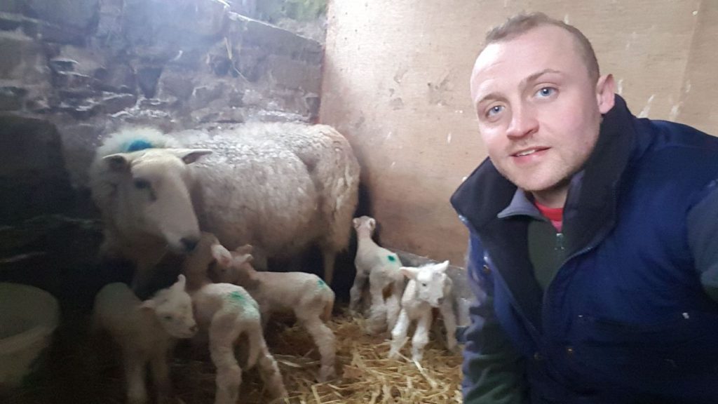 Richard O’Neill alongside the only ewe to ever give birth to quintuplets on his farm