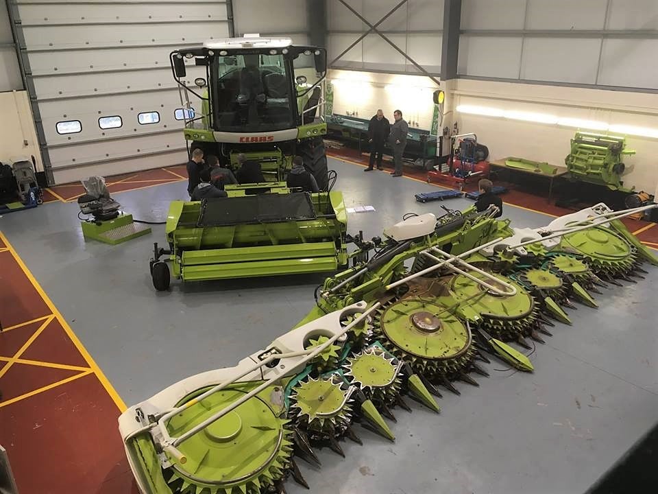 A latest-generation Claas Jaguar forager, with a pair of front-end attachments, inside the FTMTA’s training centre in Co. Kildare