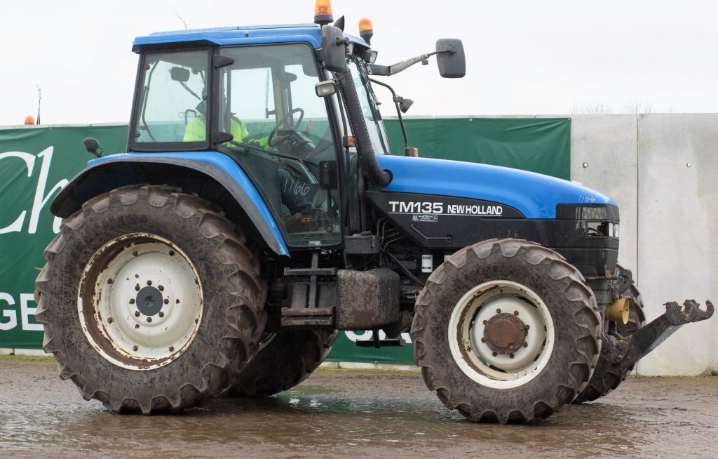 Modern workhorse: This 2002 New Holland TM135 (front linkage and PTO; 4,596 hours) sold for £13,600