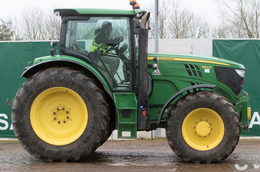 This 2015 John Deere 6150R (AutoQuad; 50kph; electric spools; TLS; cab suspension; 1,924 hours) sold for £59,000