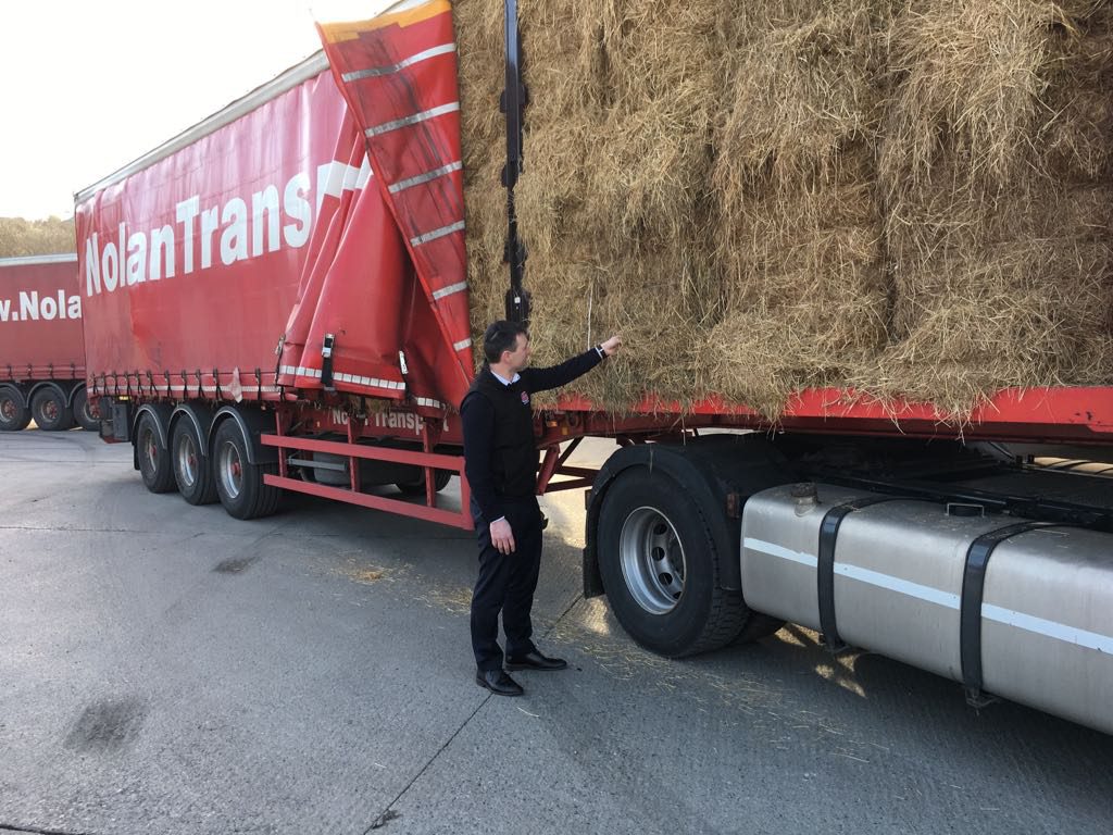 Fodder being inspected on its arrival today. Image souce: Nolan Transport