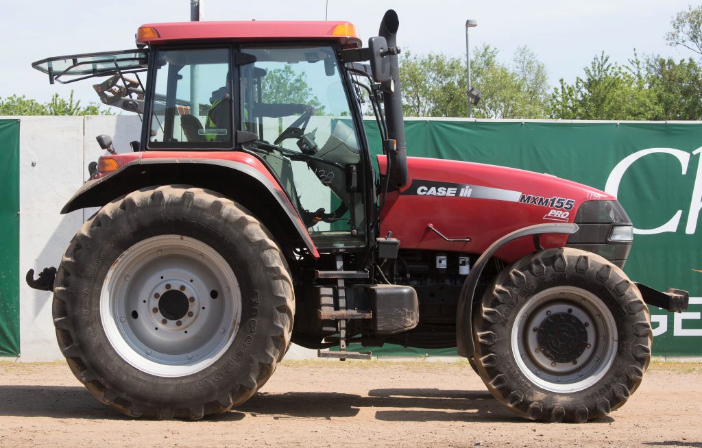 This 2005 Case IH MXM155 (similar to a New Holland TM; cab and front axle suspension; 7,655 hours) sold for £18,800