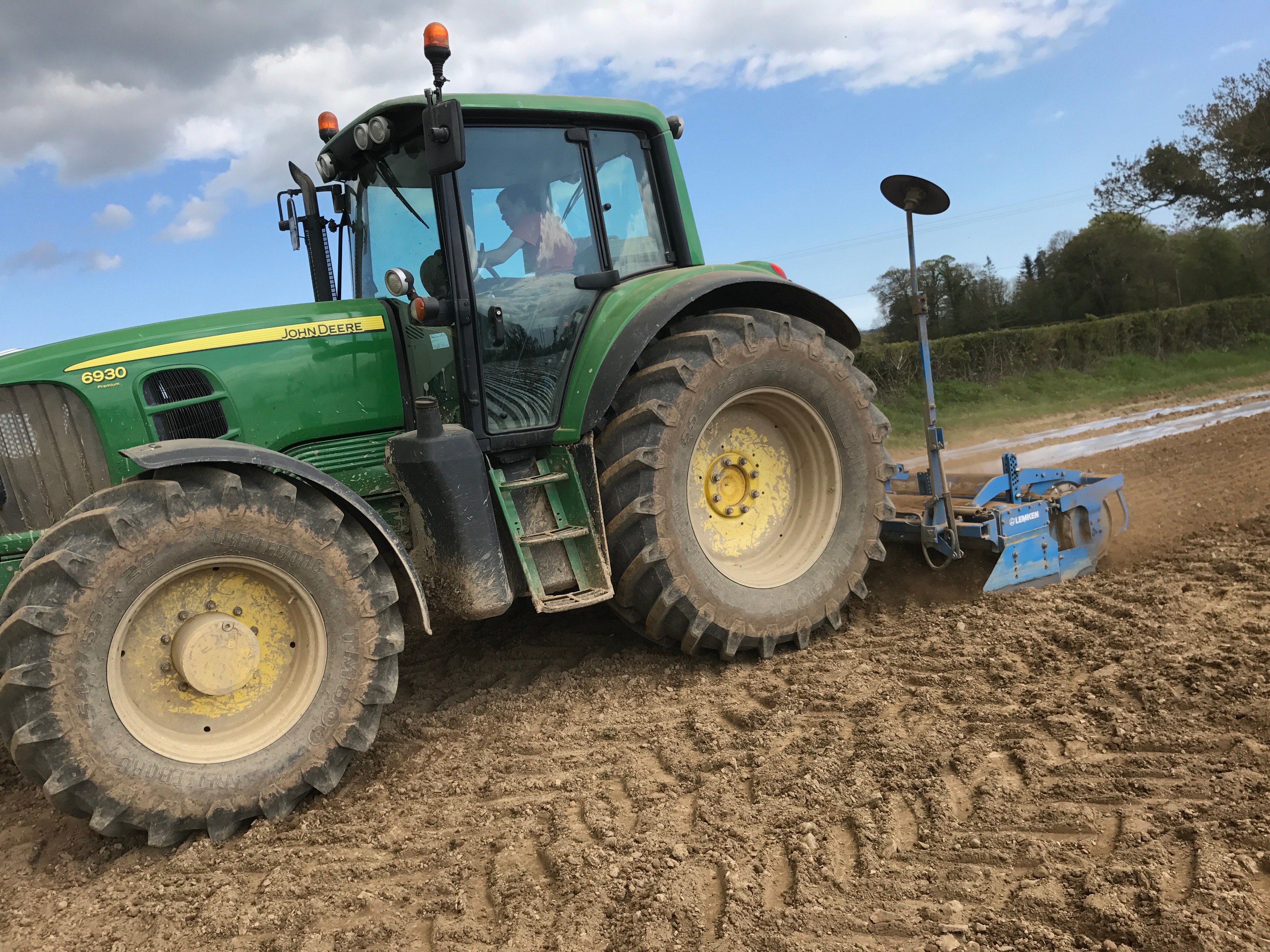 George Steacy working the power harrow ahead of the maize drill