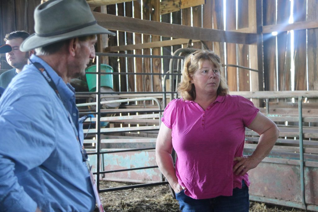 Amy White shows Australian farmers around the ranch