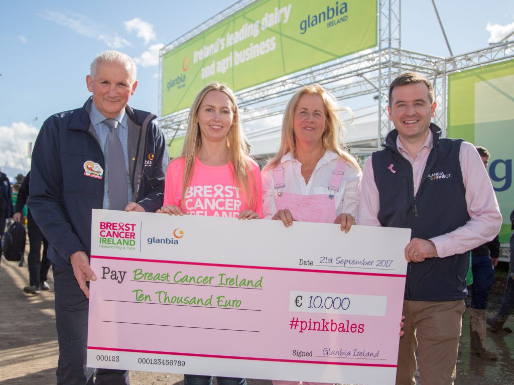 Henry Corbally, former Glanbia chairman, and James Byrne, marketing manager with Glanbia Agribusiness, present a cheque for €10,000 to Adelle Reilly from Breast Cancer Ireland. Also pictured is Margaret Hoctor from Kilmullen Farm in Co. Wicklow, who won a competition for the best photo featuring the pink silage wrap. Image source: Ger Rodgers