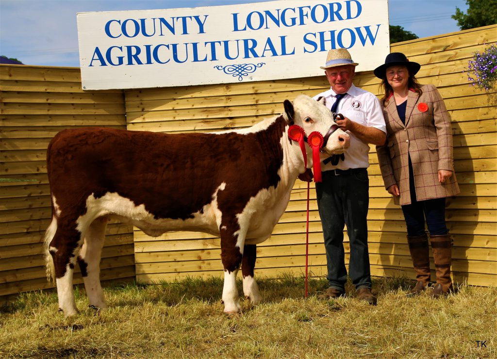 Padraig McGrath with Champion Heifer Calf Kye Holly 794 and judge Laura Vincent