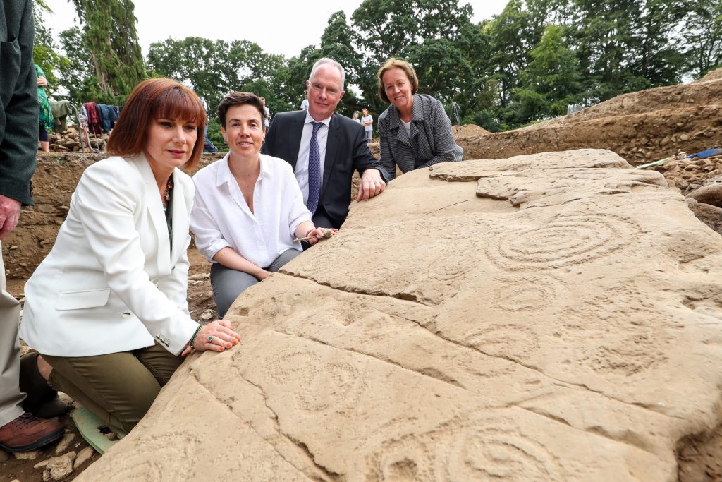 L-R: Minister for Culture, Heritage and the Gaeltacht Josepha Madigan; Dr. Cliodhna Ni Lionain, Devenish’s lead archaeologist; Devenish executive chairman Owen Brennan; and his wife Prof. Alice Stanton
