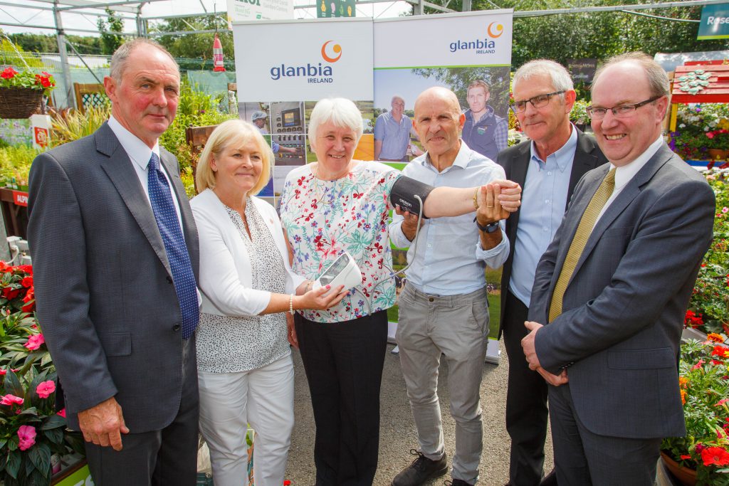Minister for State at the Department of Health, Catherine Byrne, gets her blood pressure checked by Marese Damery of Irish Heart Foundation with (from left) John Murphy, director Glanbia plc, Dr. Noel Richardson of IT Carlow; Pat Butler of Glanbia CountryLife and Sean Molloy of Glanbia Ireland. Image source: Jeff Harvey