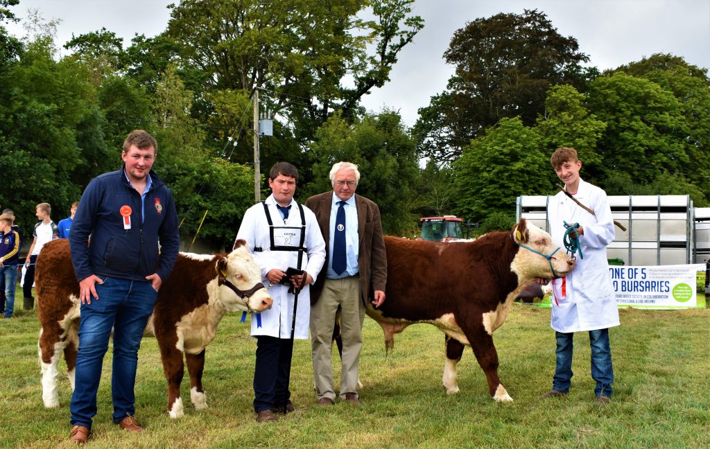 Judge Shane O’Brien beside Glen Lewis (second-placed winner), Martin Murphy (IHBS president) and Daniel Farrell (first-place winner) in the senior section of the young handlers