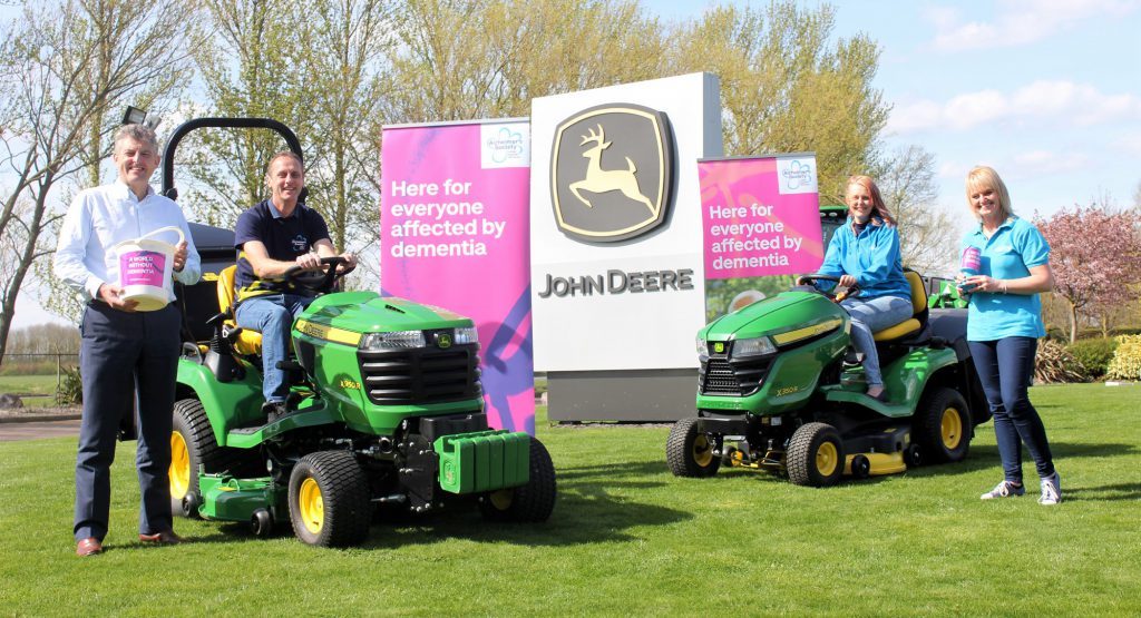 John Deere Limited Turf Division Manager Chris Meacock; Andy and Kathryn Maxfield; and Alzheimer’s Society Regional Community Fundraising Officer Sue Swire