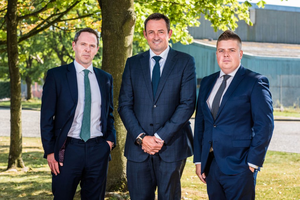 L-R: Michael Neill, partner at Top 100 sponsor A&amp;L Goodbody; Chris Kirke, president of Moy Park; and Ulster Business editor John Mulgrew. Image source: Elaine Hill