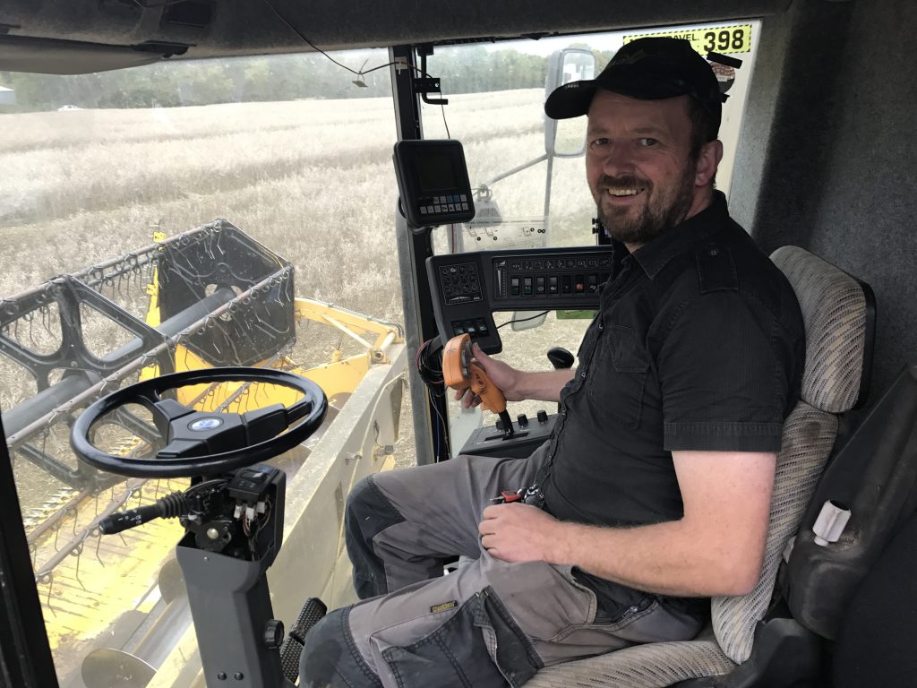 Gary Pearson cutting his crop of oilseed rape