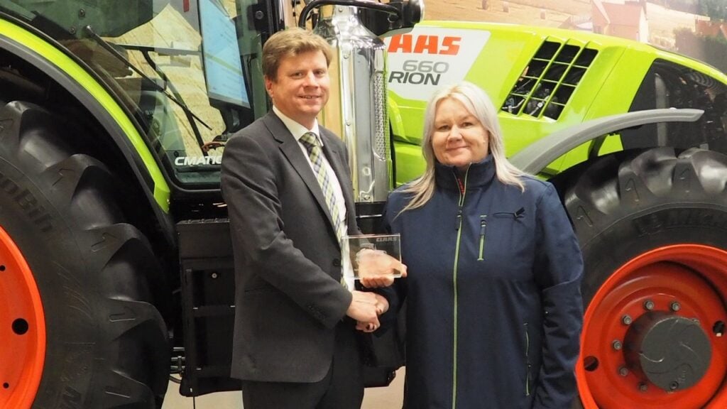 Nicola Jones of Riverlea (right) receives the Tractor Sales Growth Award from Alister Lamb (director of sales and marketing, Claas tractor division)