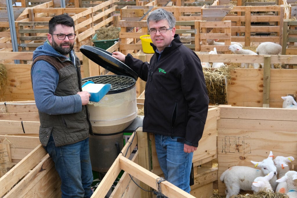 Volac senior technician David Johnston (right) checks how John McKavanagh is getting on in the lamb sheds.Image source: Columba O’Hare