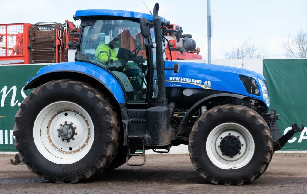 This 2011/2012 New Holland T7.260 (50kph; front axle and cab suspension; SideWinder; IntelliView; 8,520 hours) sold for £27,000