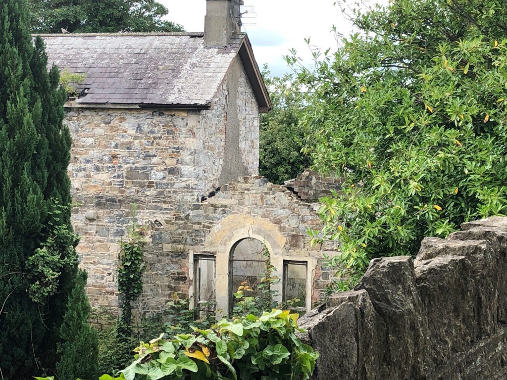 Behind the railings and the locked gate is the old railway house and land