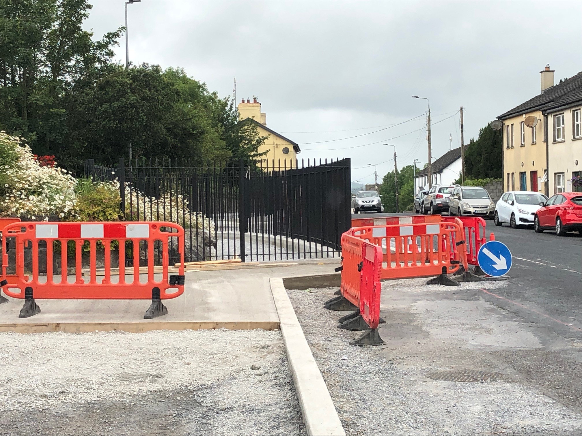 Railings have been installed and a new footpath in the heart of the village has taken half the road with it
