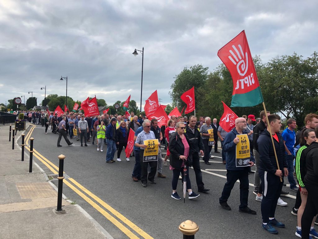 Bord na Móna workers, their families and members of the community march through Lanesboro