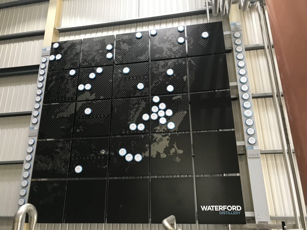A map with each of the growers’ farms hangs high in the distillery