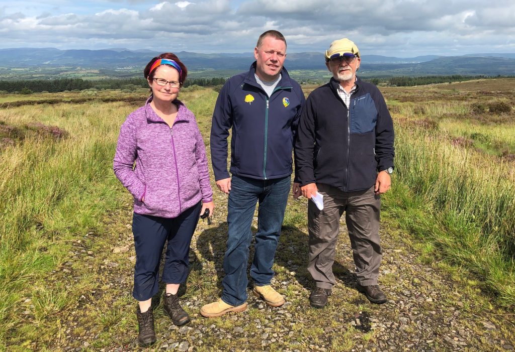 Adrienne Diamond, Councillor Padraig Fallon and Graham Robertson in the area where the wind farm will be developed