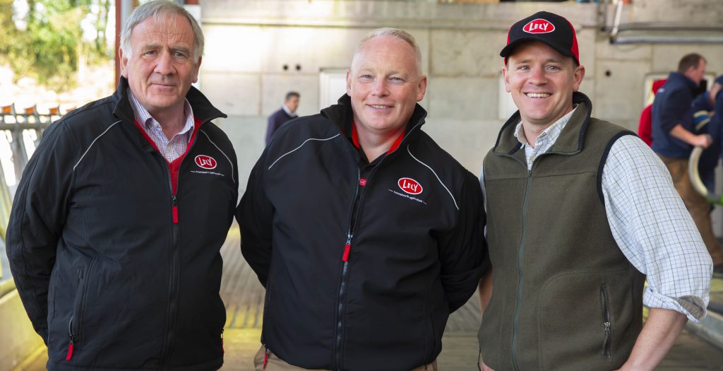 Tom O’Leary, general manager of Lely Center Enniscorthy (centre) with Gerald and Henry Dunne on their farm in Bree, Enniscorthy. Image source: Patrick Browne