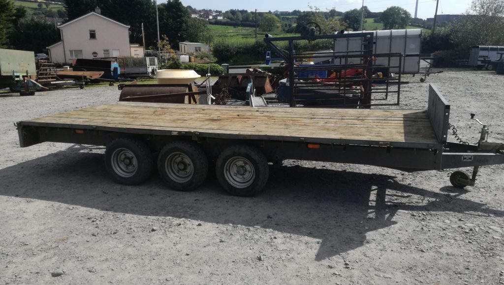This tri-axle, flat-bed trailer will go under the hammer on Saturday