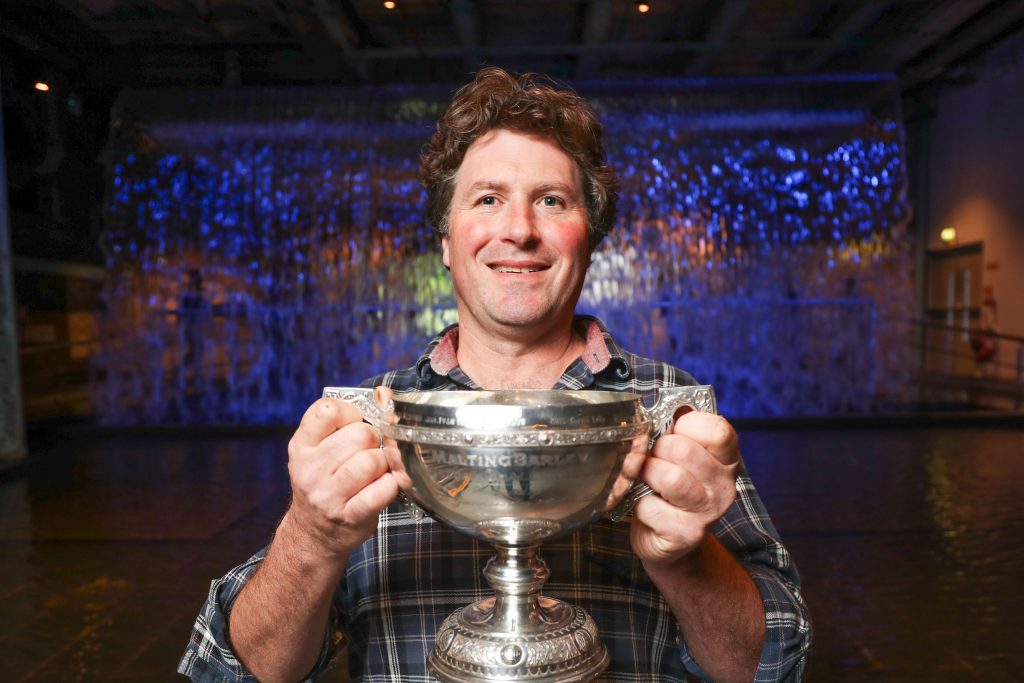 Pictured with the Guinness Perpetual Cup for Malting Barley Excellence from Boortmalt and Diageo Ireland is Carlow’s Evan McDonnell after growing the best malting barley this year. Image source: Naoise Culhane